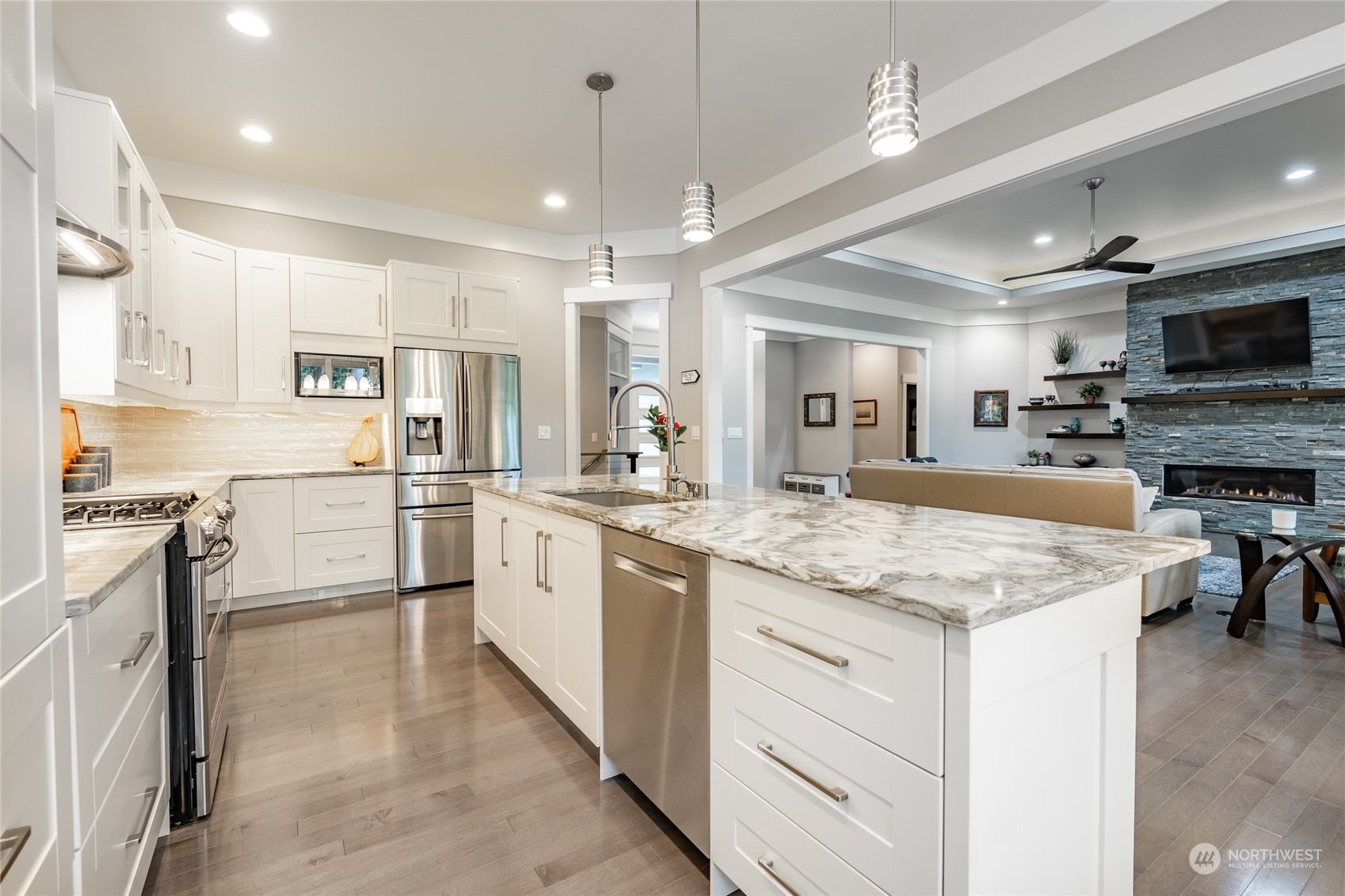 5433 Canvasback Road Blaine, WA 98230 - Photo 11 of 34 a kitchen with kitchen island granite countertop stainless steel appliances cabinets a sink and a counter top space
