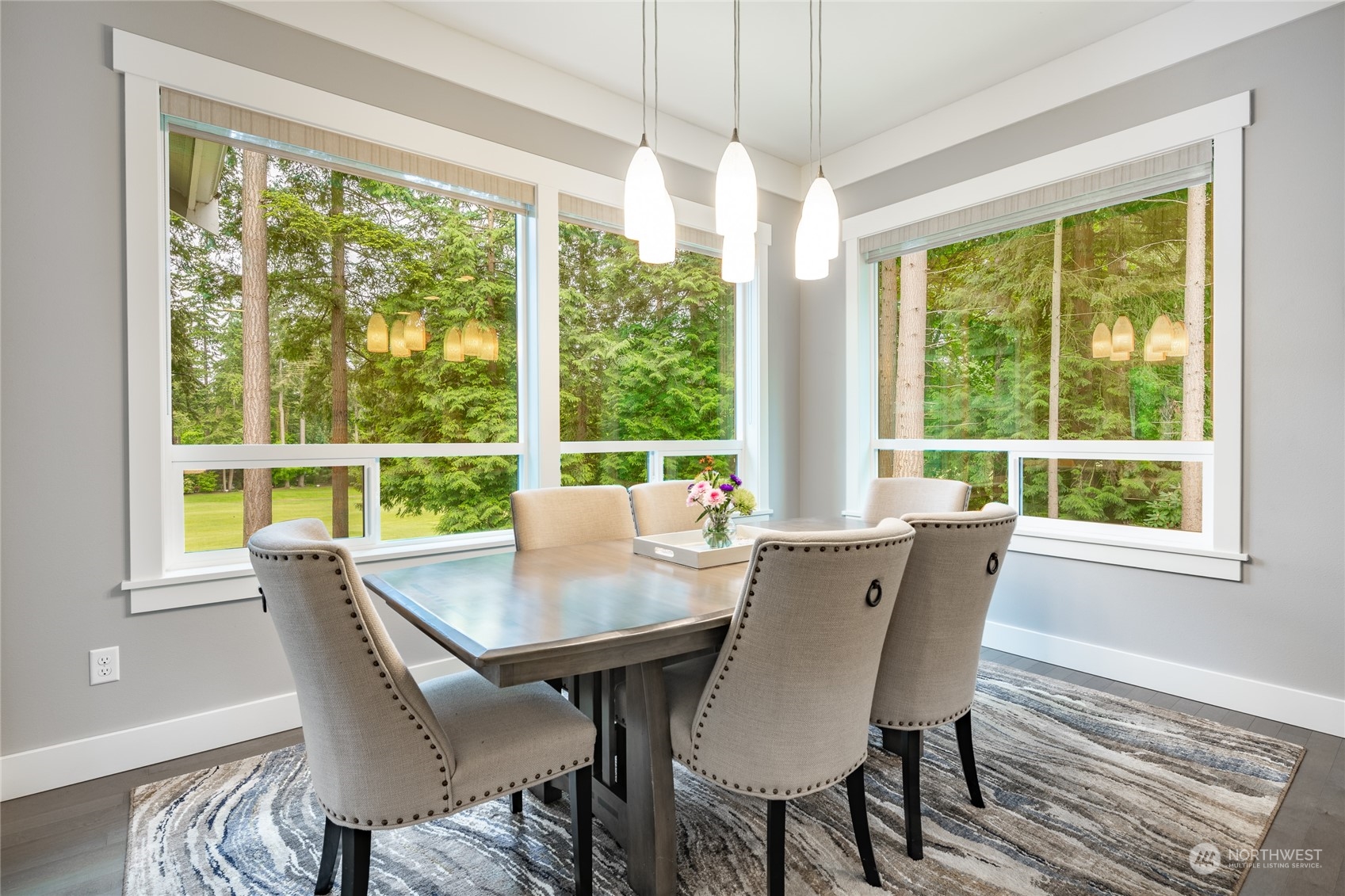 5433 Canvasback Road Blaine, WA 98230 - Photo 12 of 34 a view of a dining room with furniture window and wooden floor