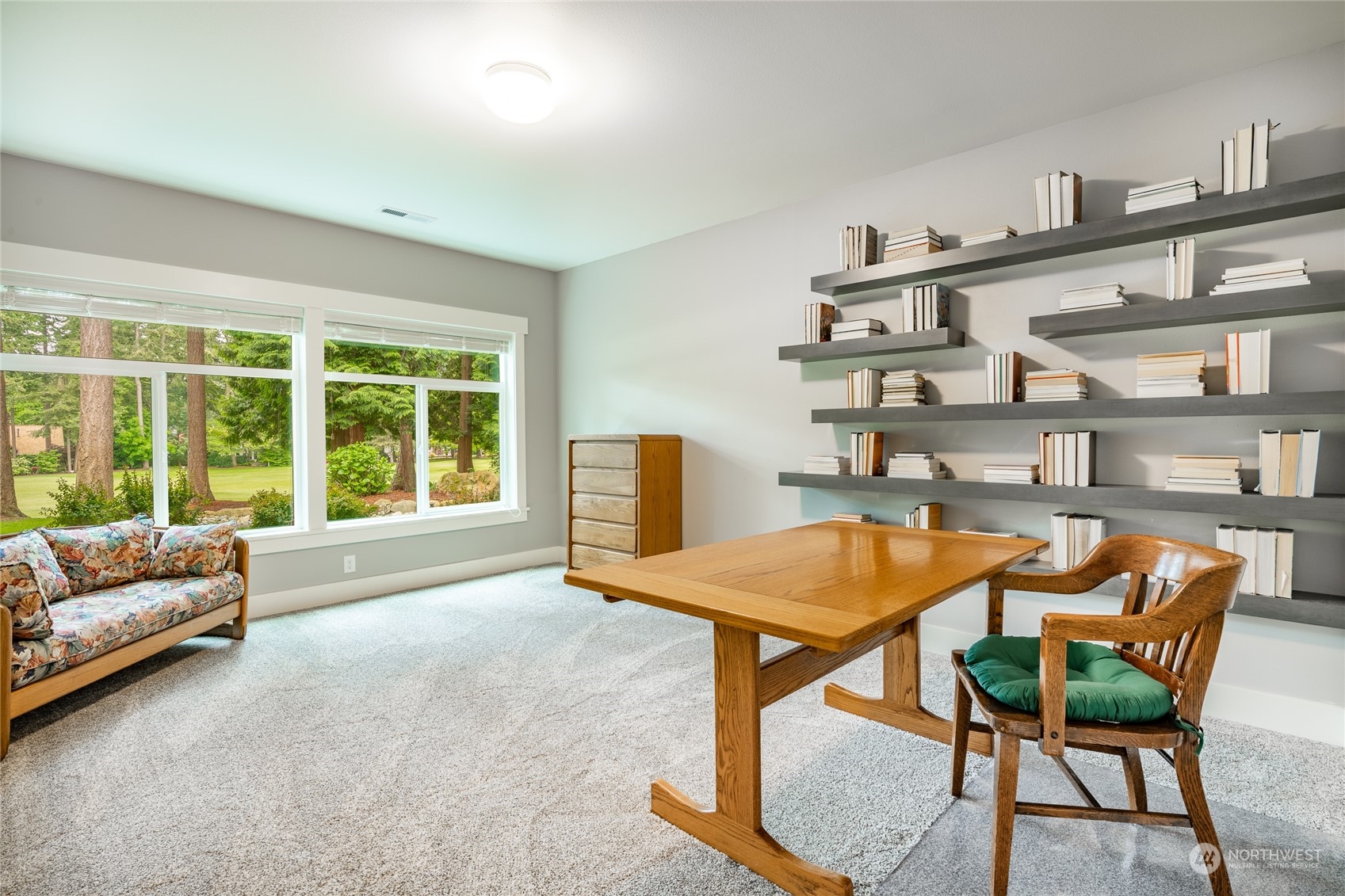 5433 Canvasback Road Blaine, WA 98230 - Photo 23 of 34 a dining room with furniture and a floor to ceiling window
