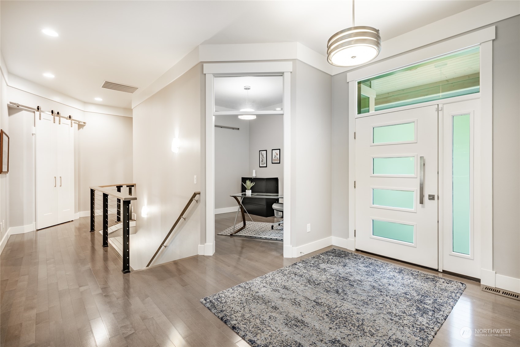 5433 Canvasback Road Blaine, WA 98230 - Photo 3 of 34 a view of a livingroom with wooden floor and a ceiling fan