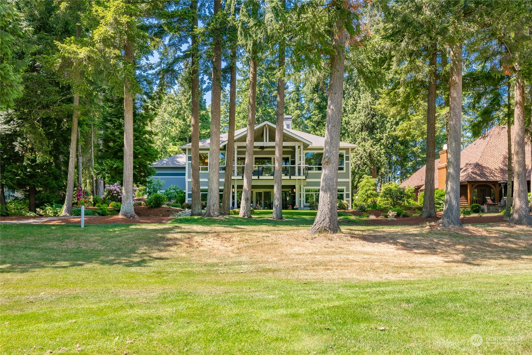5433 Canvasback Road Blaine, WA 98230 - Photo 34 of 34 a front view of a house with a garden