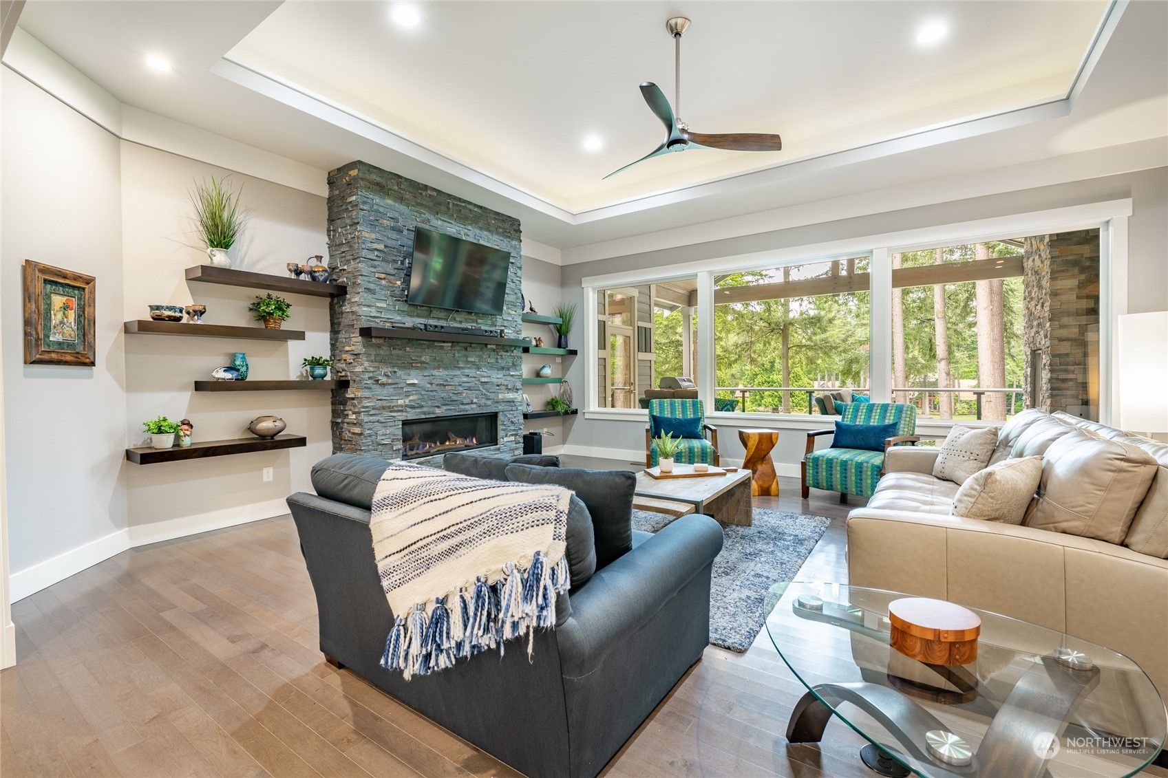5433 Canvasback Road Blaine, WA 98230 - Photo 5 of 34 a living room with fireplace furniture and a large window