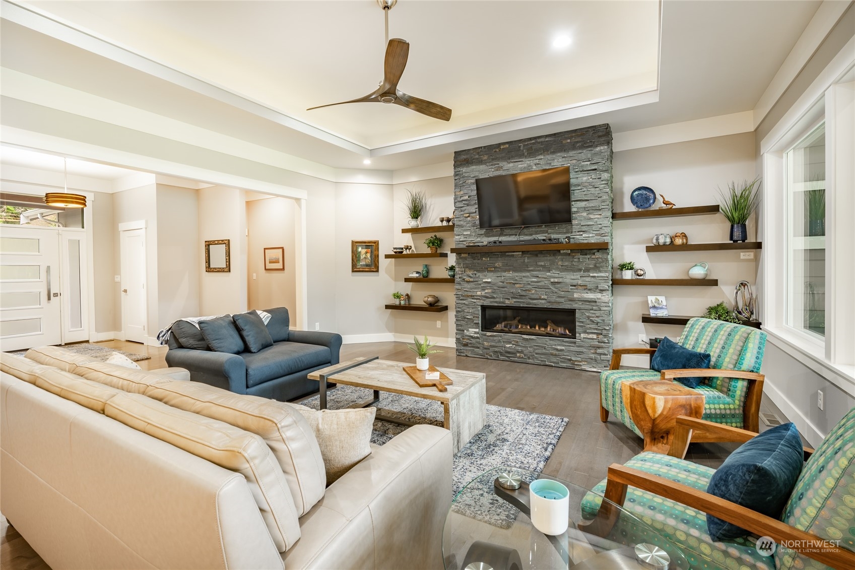 5433 Canvasback Road Blaine, WA 98230 - Photo 7 of 34 a living room with furniture fireplace and a flat screen tv