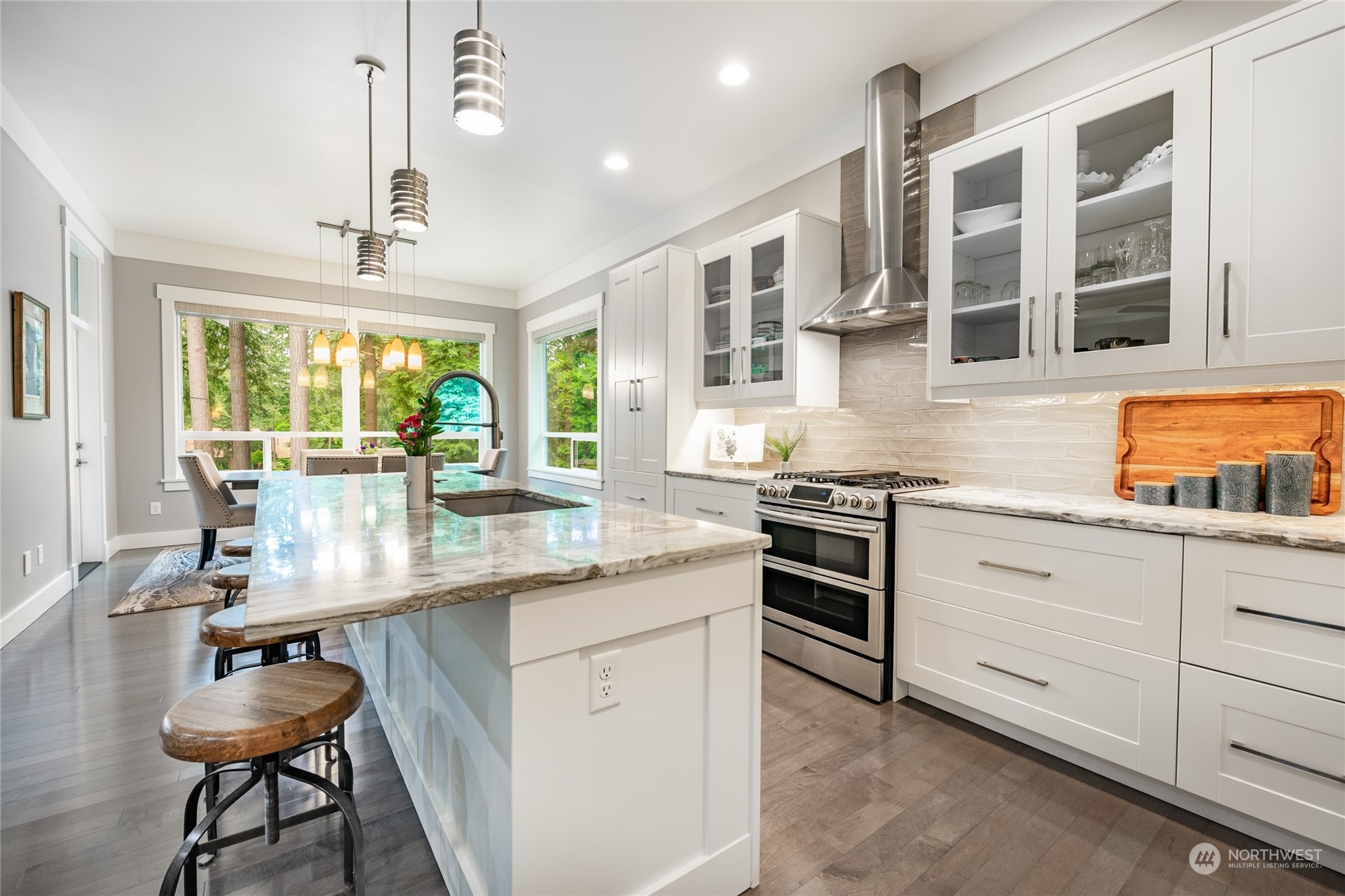 5433 Canvasback Road Blaine, WA 98230 - Photo 9 of 34 a kitchen with stainless steel appliances granite countertop a stove and more cabinets