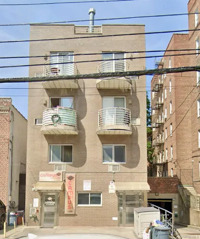 a front view of a building with multiple windows