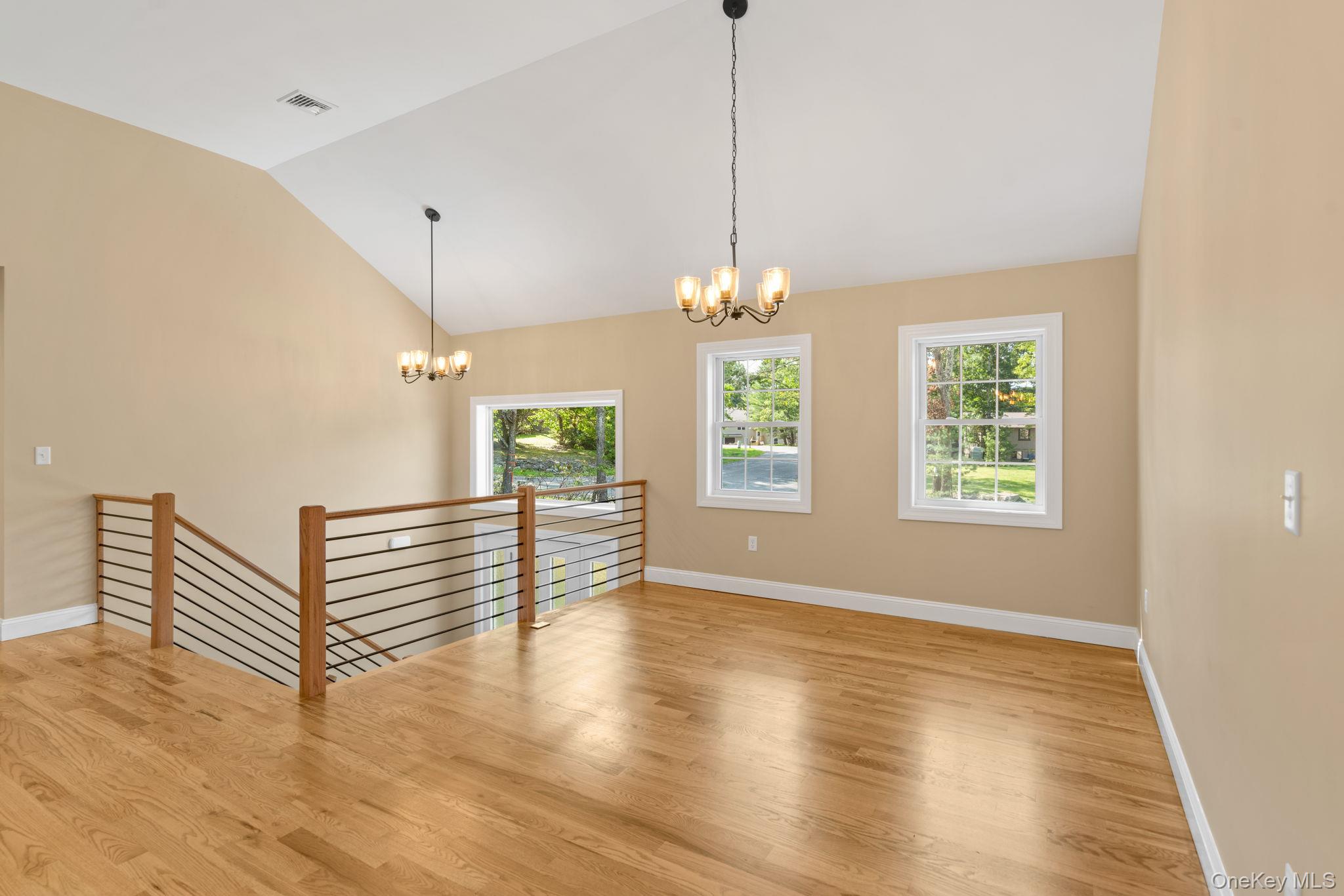 61 Smith Avenue Walden, NY 12586 - Photo 11 of 42 a view of an empty room with wooden floor and window