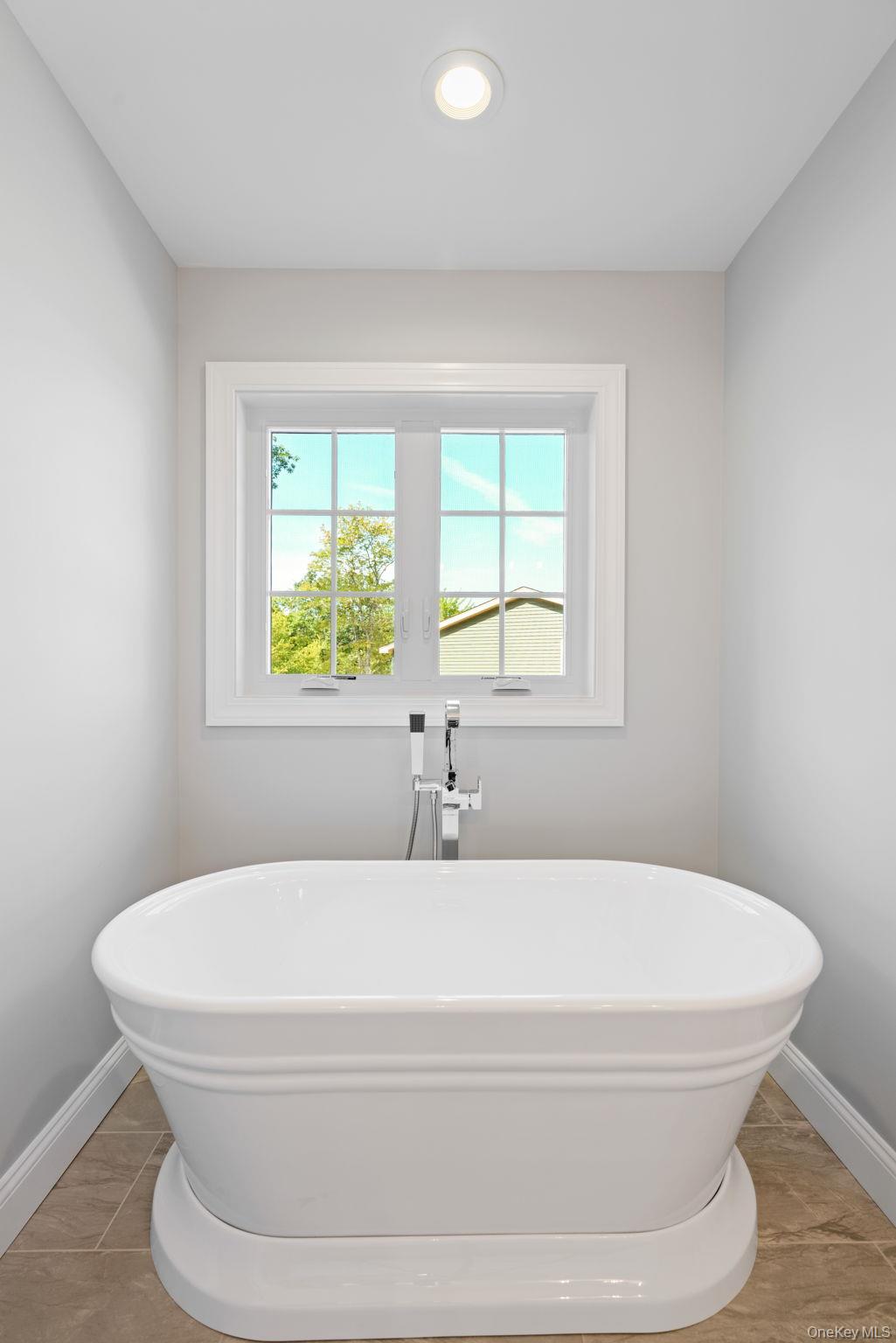 61 Smith Avenue Walden, NY 12586 - Photo 19 of 42 a bathroom with a granite countertop window a sink and a window