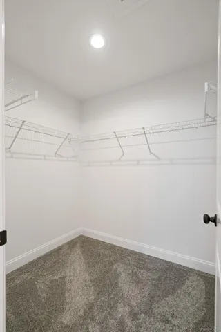 a bathroom with a granite countertop window a sink and a window