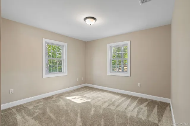 a bathroom with a shower and a glass door