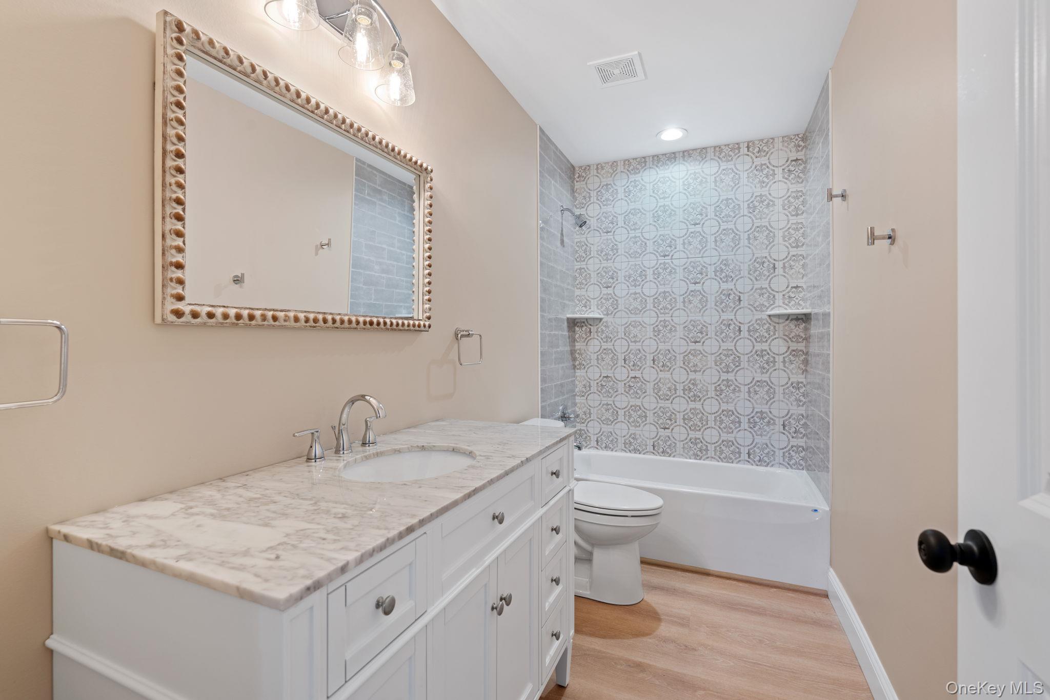 61 Smith Avenue Walden, NY 12586 - Photo 37 of 42 a bathroom with a sink a toilet and shower