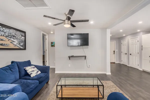 a living room with furniture and a rug