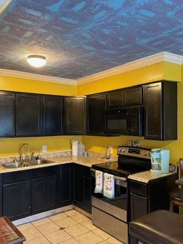 a kitchen with a sink and cabinets