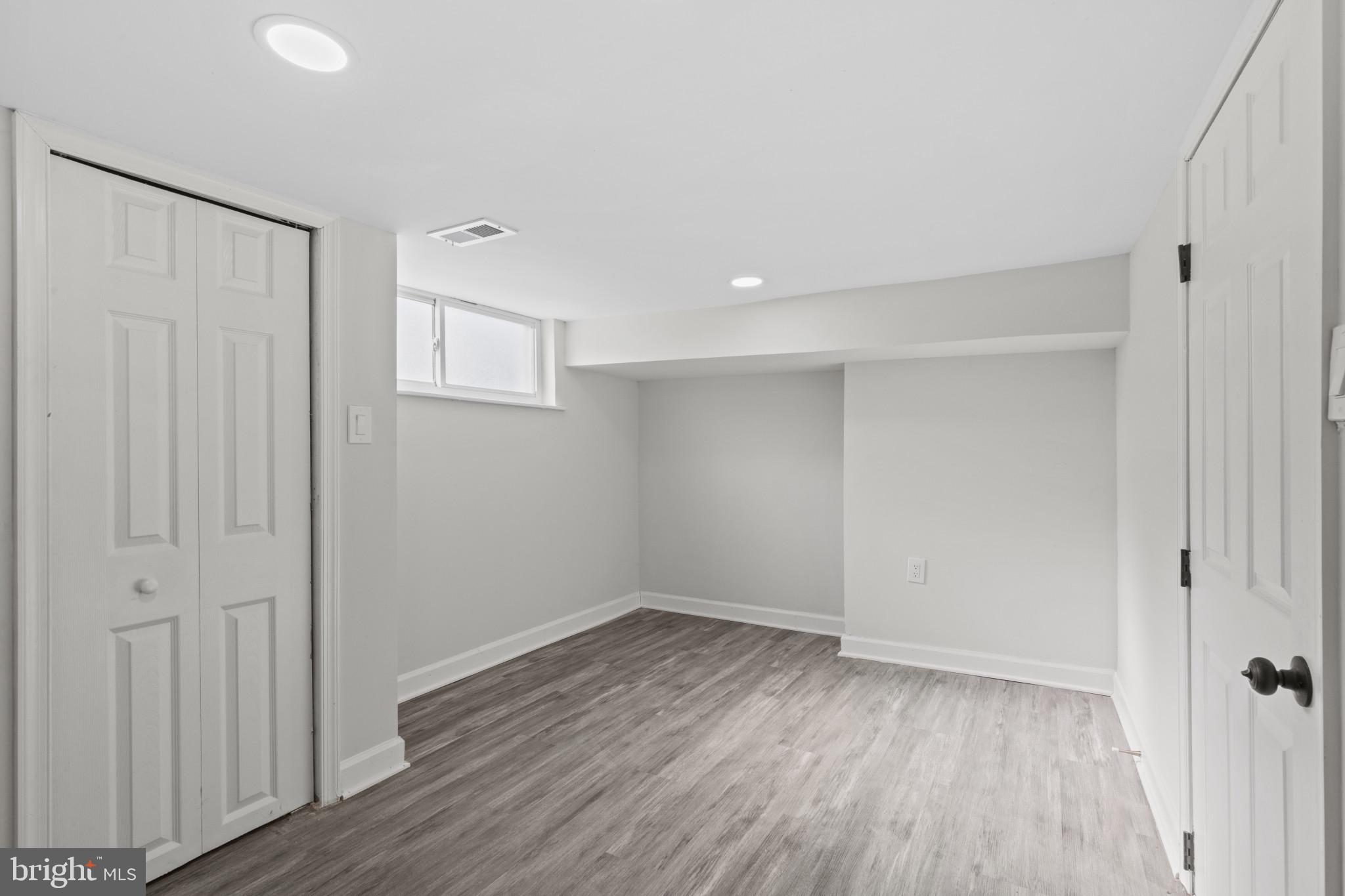 3404 East Pratt Street Baltimore, MD 21224 - Photo 23 of 39 a view of an empty room with wooden floor