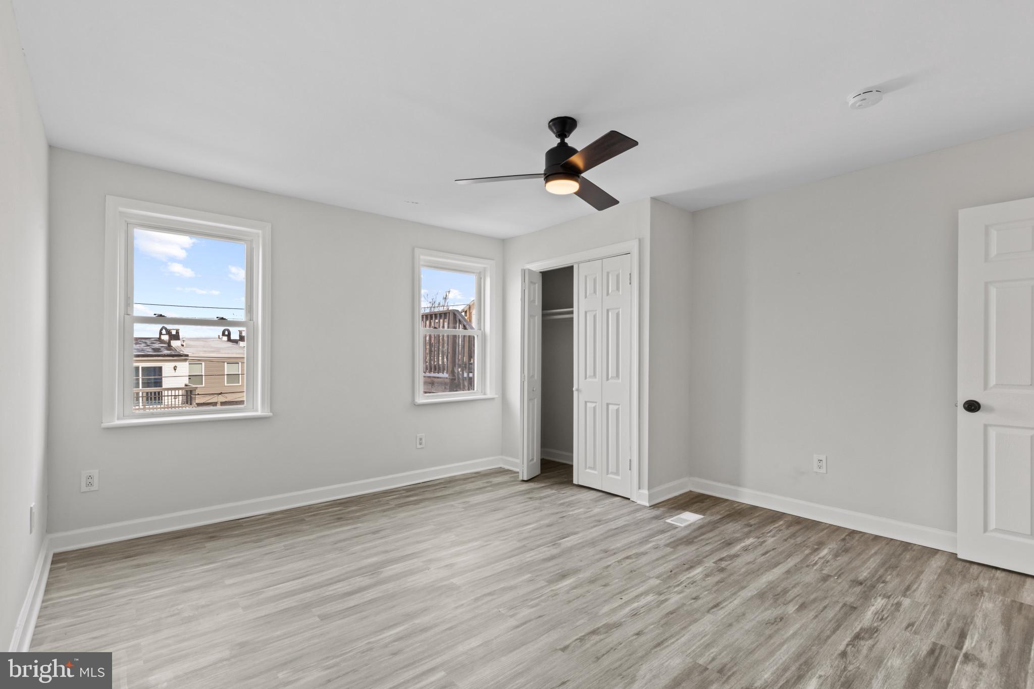 3404 East Pratt Street Baltimore, MD 21224 - Photo 31 of 39 a view of empty room with wooden floor and fan