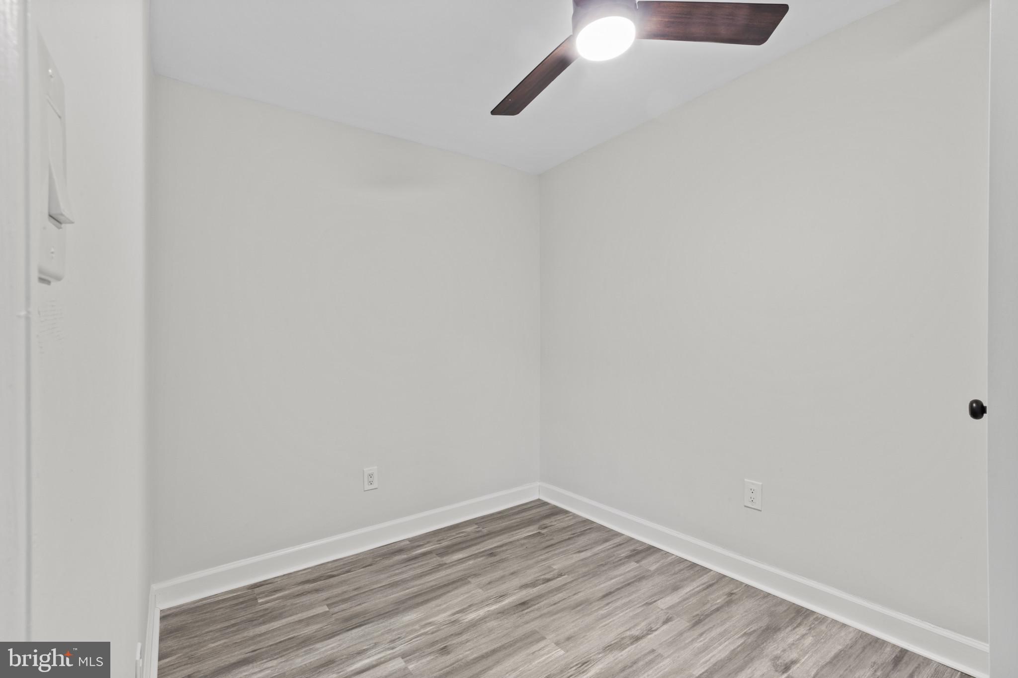 3404 East Pratt Street Baltimore, MD 21224 - Photo 33 of 39 a view of an empty room with wooden floor and closet