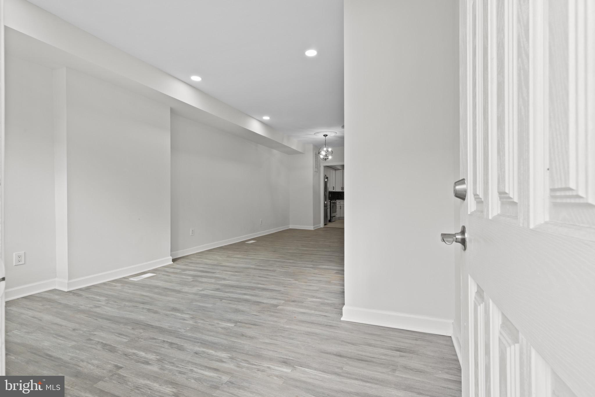3404 East Pratt Street Baltimore, MD 21224 - Photo 5 of 39 a view of a hallway with wooden floor