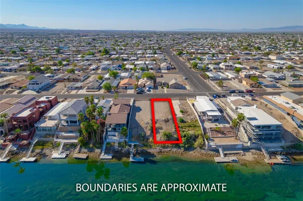 an aerial view of multiple houses with yard