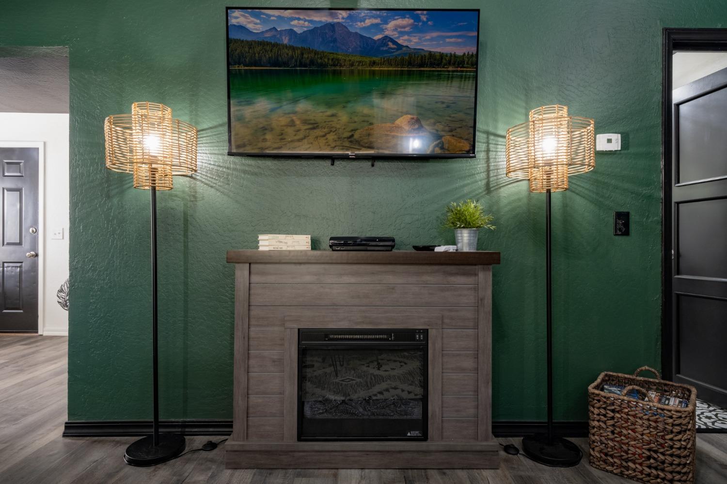 25941 Ellmaro Road Long Barn, CA 95335 - Photo 13 of 74 a living room with a fireplace