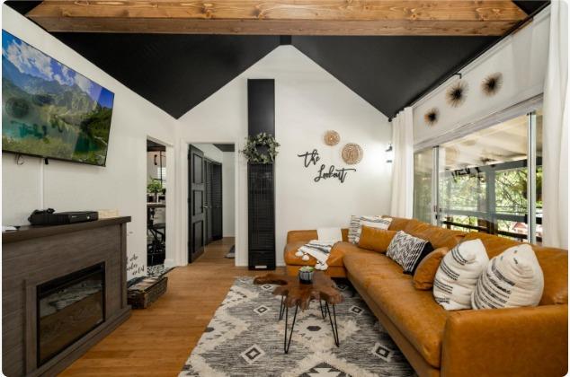 25941 Ellmaro Road Long Barn, CA 95335 - Photo 2 of 74 a living room with furniture and a flat screen tv