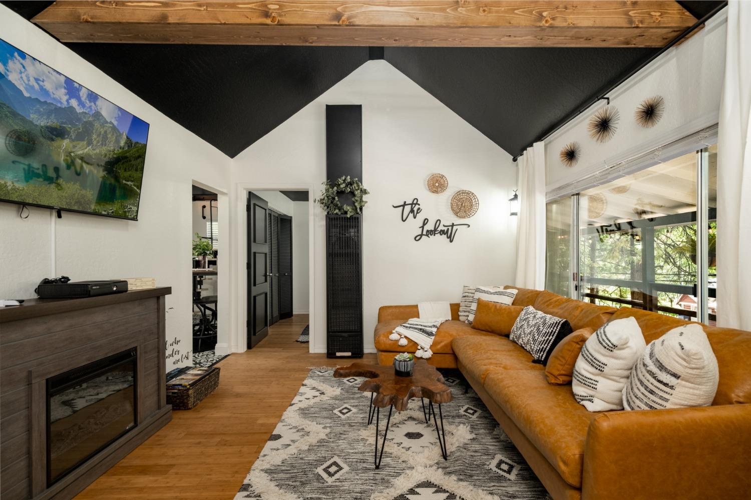 25941 Ellmaro Road Long Barn, CA 95335 - Photo 46 of 74 a living room with furniture and a flat screen tv