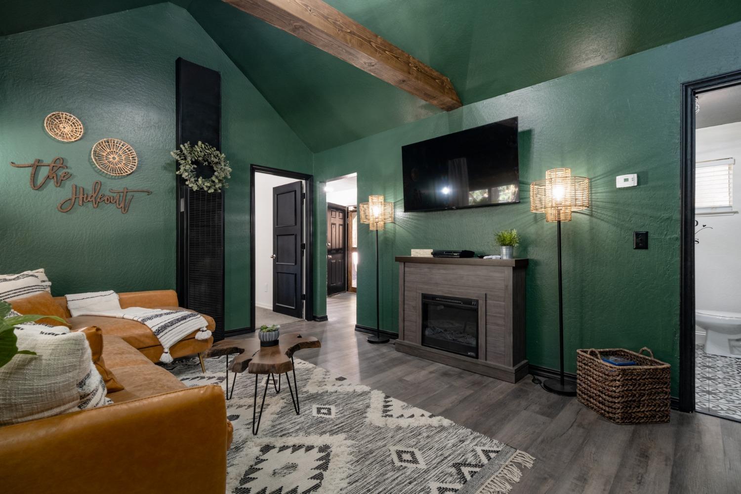 25941 Ellmaro Road Long Barn, CA 95335 - Photo 5 of 74 a living room with furniture and a fireplace