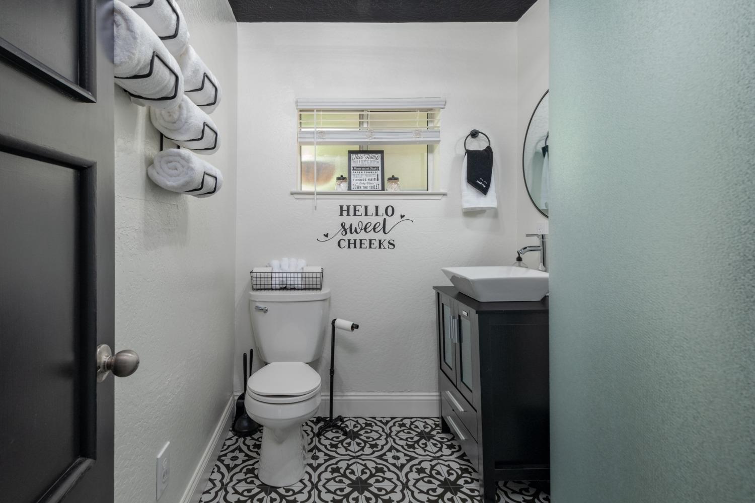 25941 Ellmaro Road Long Barn, CA 95335 - Photo 63 of 74 a bathroom with a toilet sink and mirror