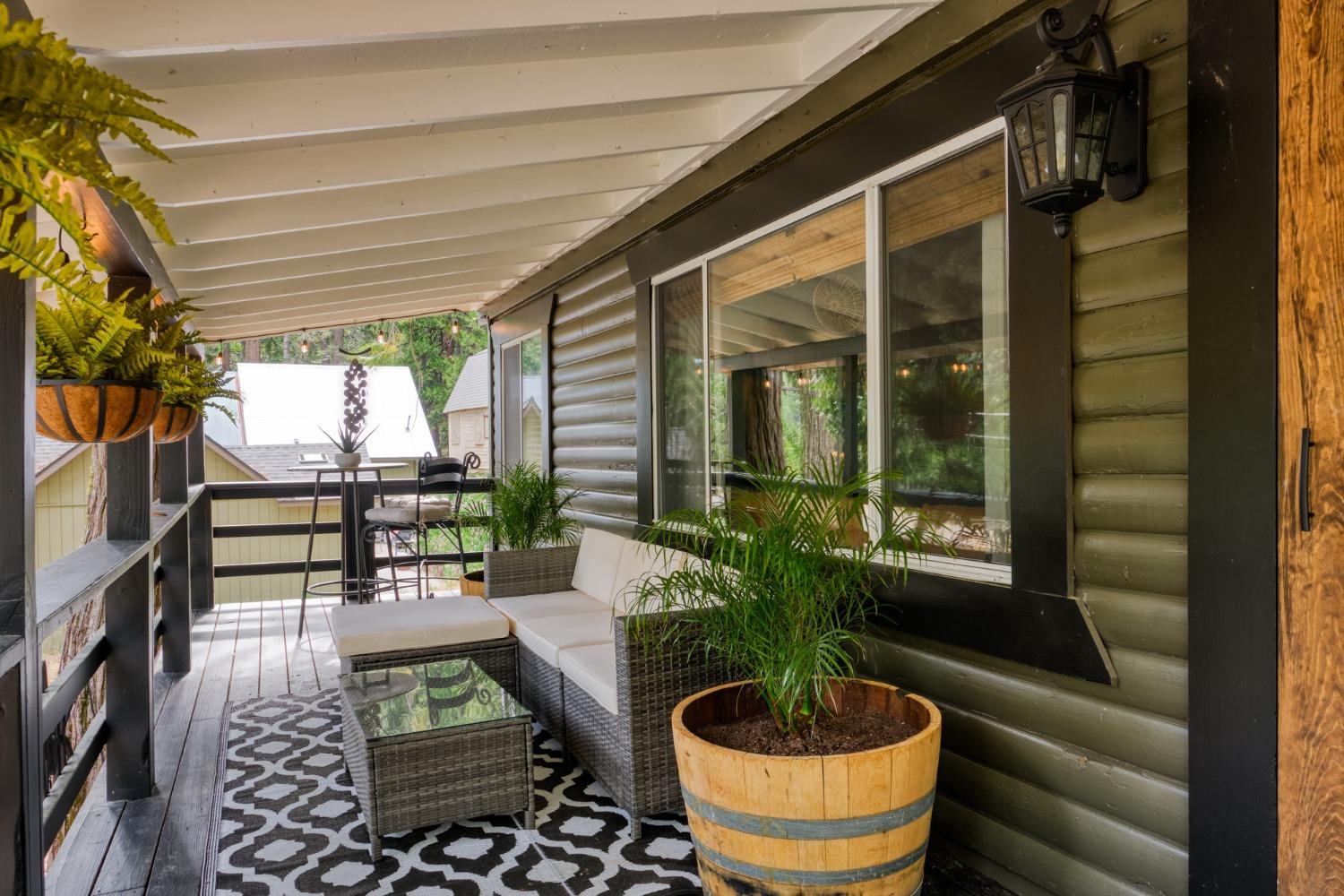 25941 Ellmaro Road Long Barn, CA 95335 - Photo 7 of 74 a living room with patio furniture and a potted plant