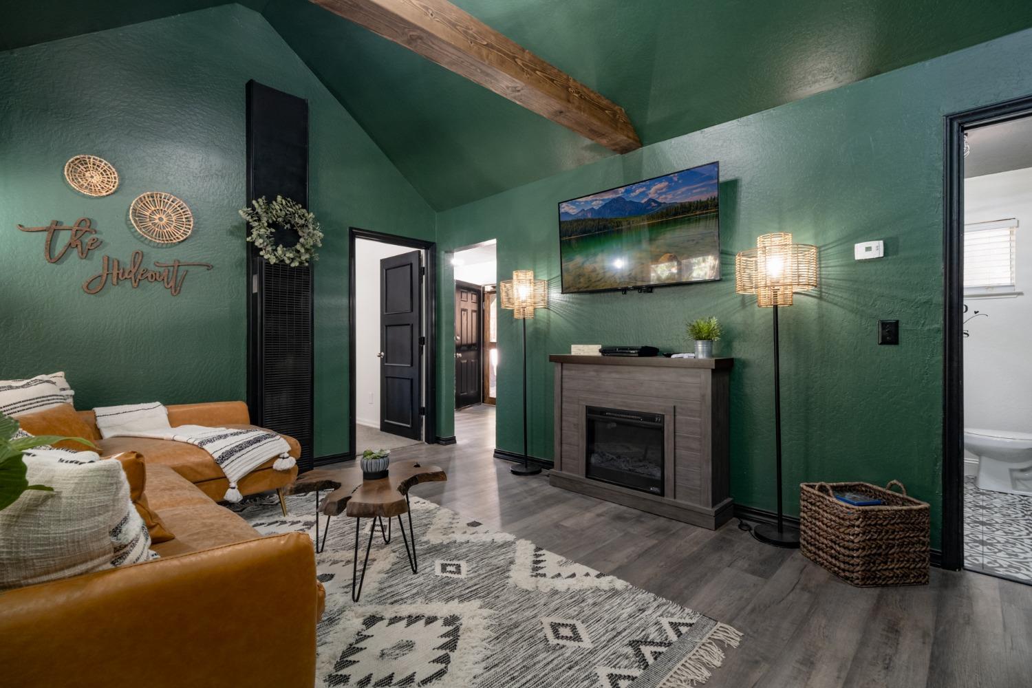 25941 Ellmaro Road Long Barn, CA 95335 - Photo 10 of 74 a living room with furniture and a fireplace