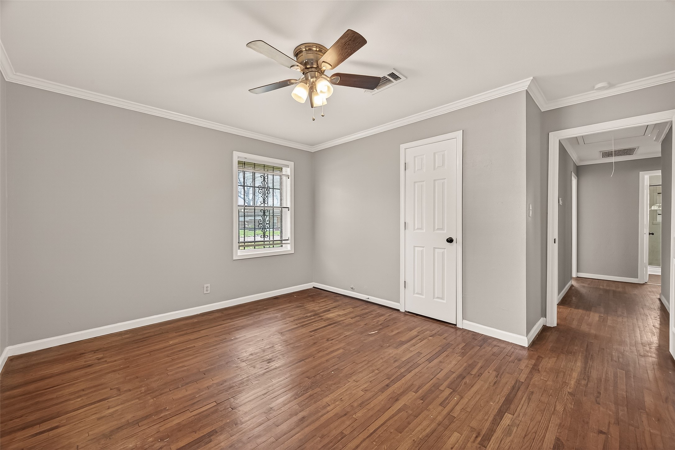 2619 Homer Street Houston, TX 77091 - Photo 11 of 23 a view of an empty room with wooden floor