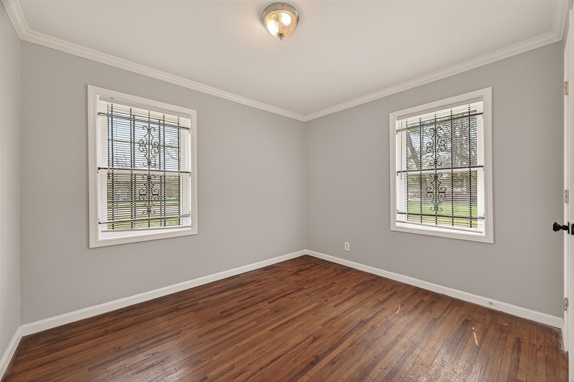 2619 Homer Street Houston, TX 77091 - Photo 15 of 23 a view of an empty room with wooden floor and a window