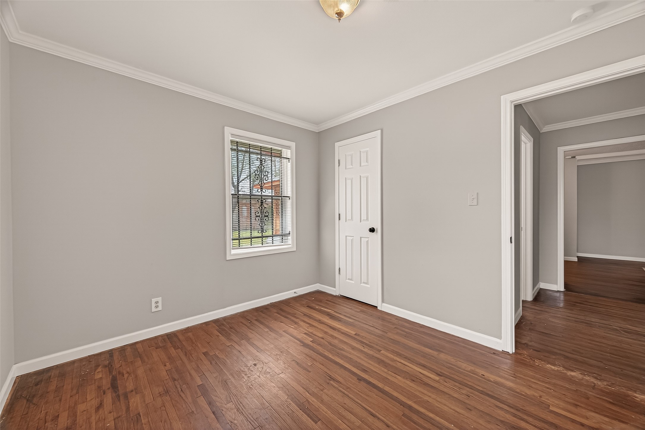 2619 Homer Street Houston, TX 77091 - Photo 16 of 23 a view of a room with wooden floor and windows