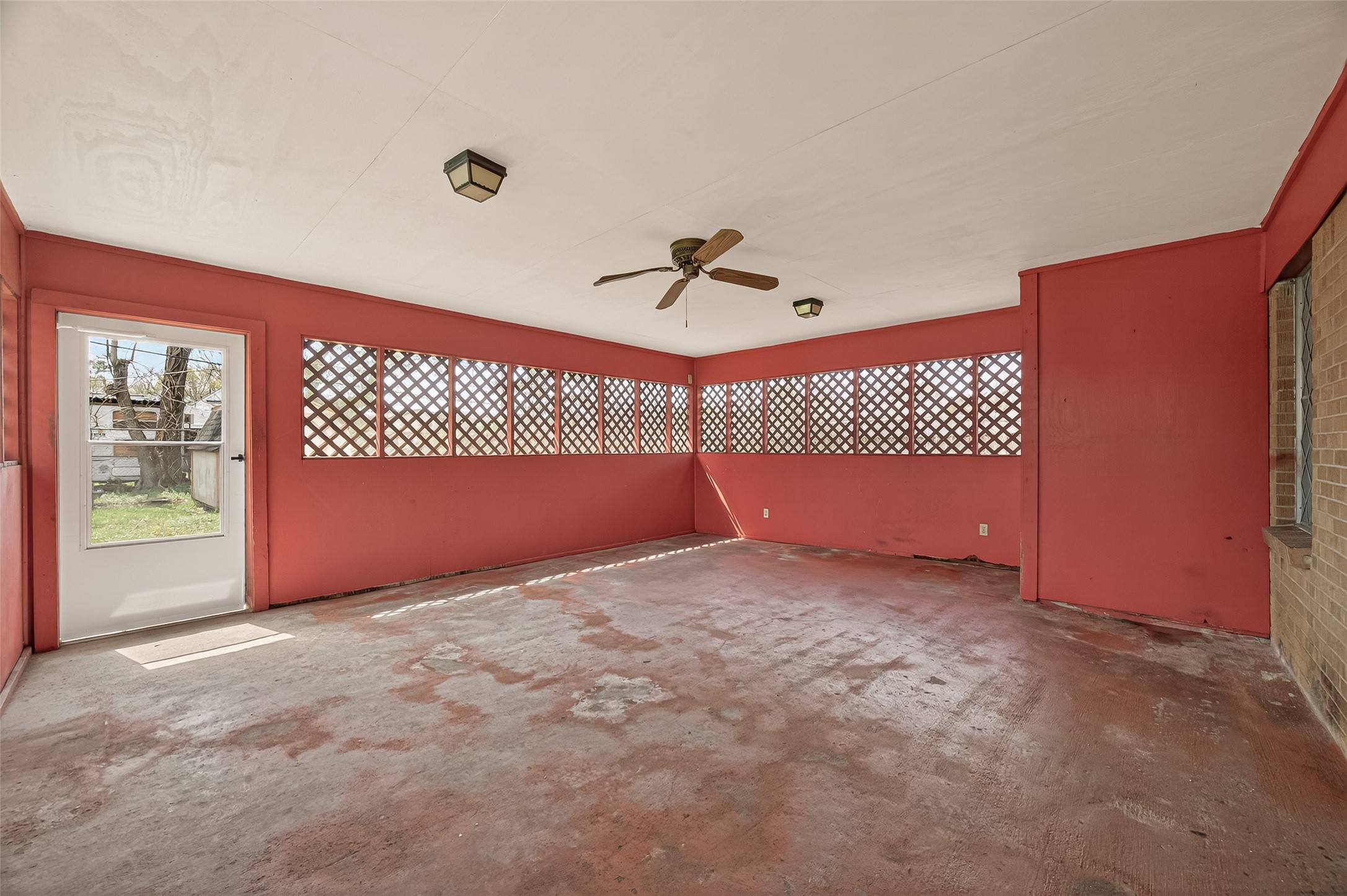 2619 Homer Street Houston, TX 77091 - Photo 17 of 23 a view of a room with a ceiling fan and a window