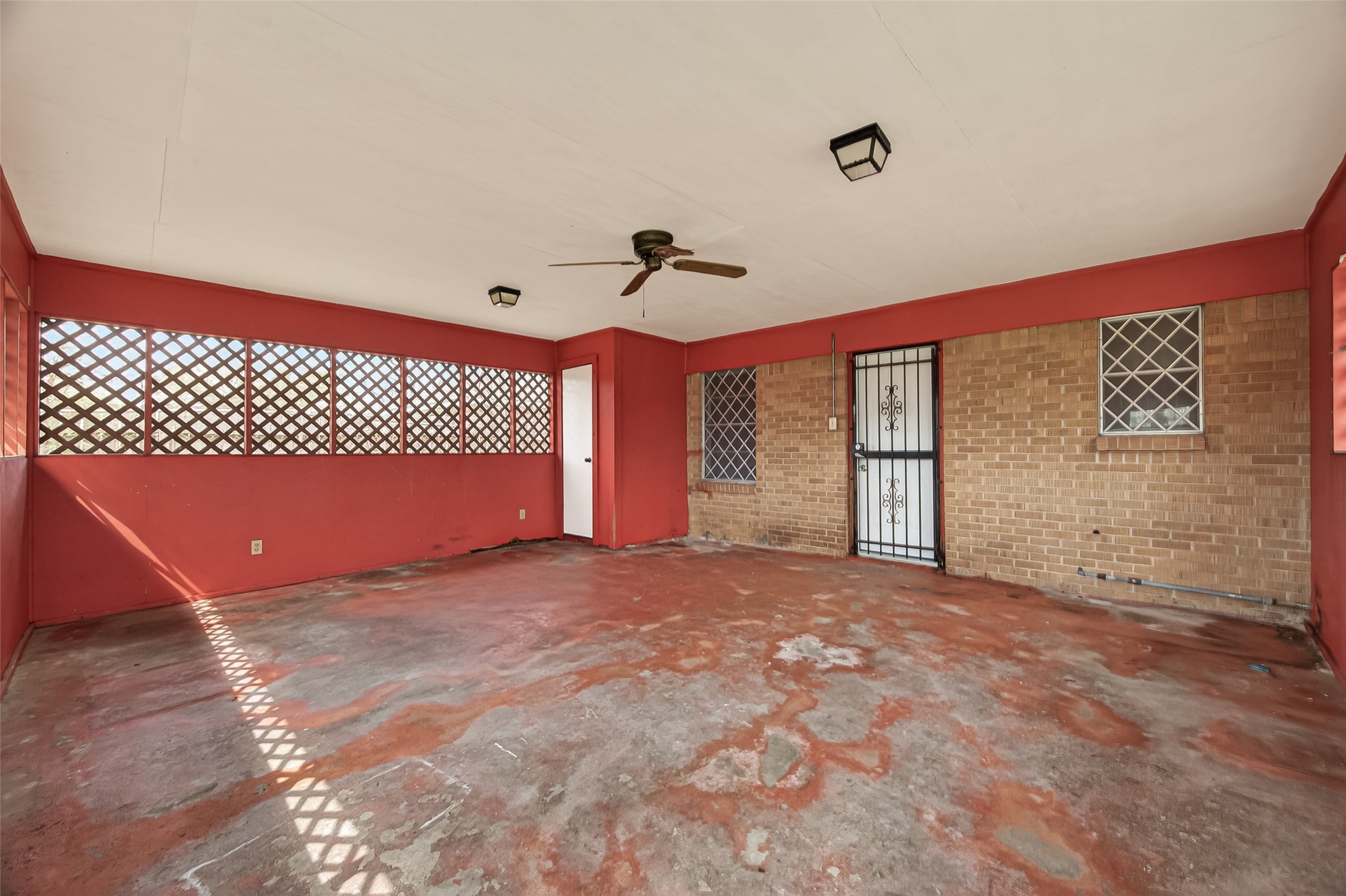 2619 Homer Street Houston, TX 77091 - Photo 18 of 23 a view of a room with sliding door and ceiling fan
