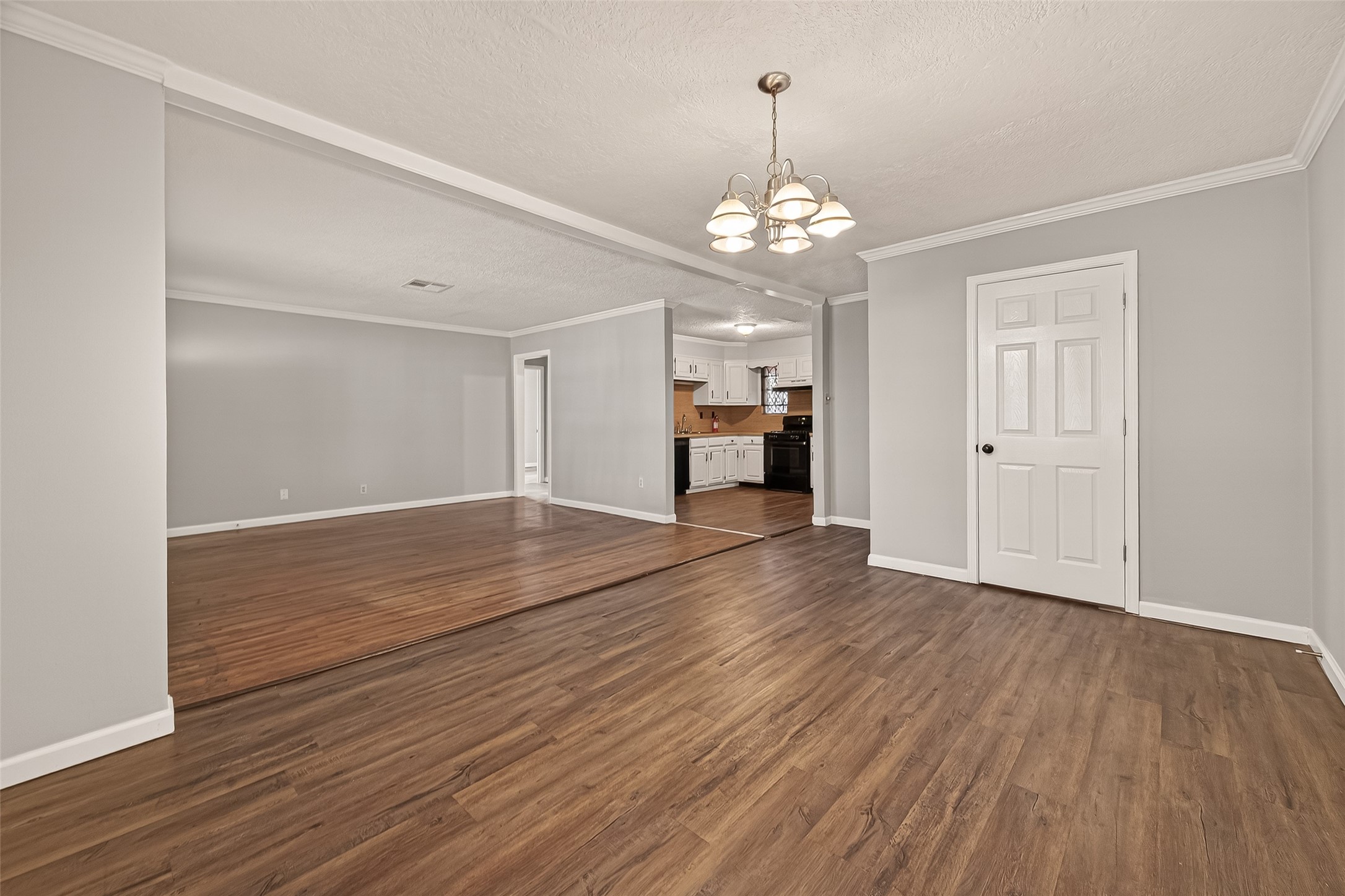 2619 Homer Street Houston, TX 77091 - Photo 4 of 23 a view of a livingroom with a furniture wooden floor and chandelier