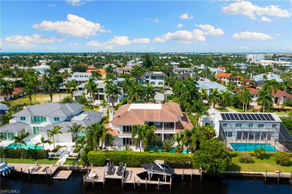 590 17th Avenue South Naples, FL 34102 - Photo 2 of 50 an aerial view of residential houses and car parked in street