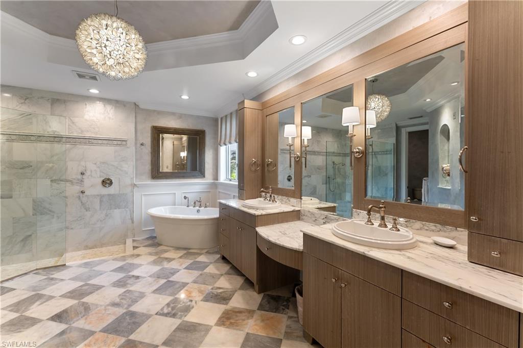 590 17th Avenue South Naples, FL 34102 - Photo 23 of 50 a large bathroom with a double vanity sink mirror and double