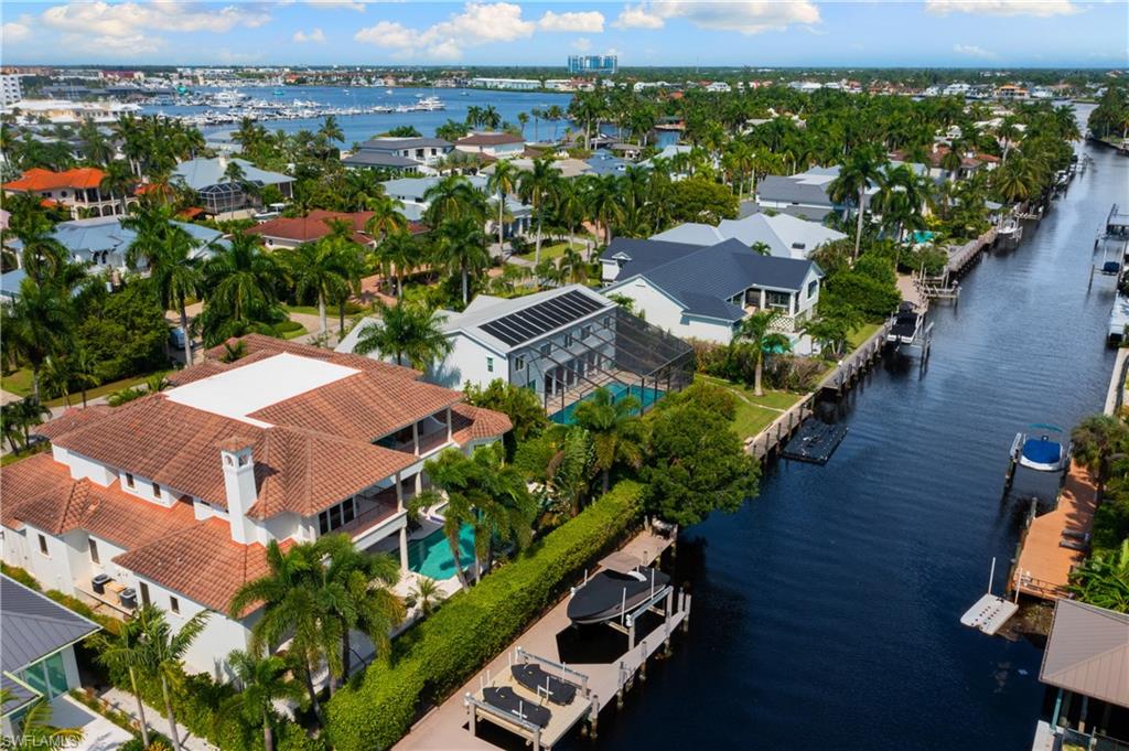 590 17th Avenue South Naples, FL 34102 - Photo 3 of 50 an aerial view of residential houses with outdoor space and trees