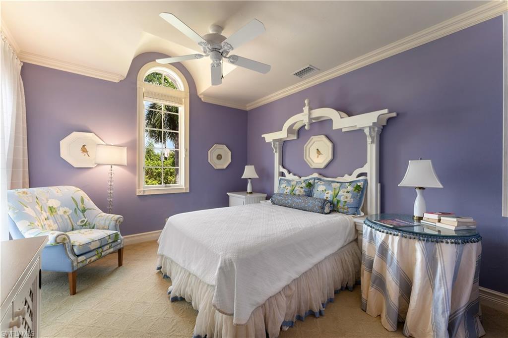 590 17th Avenue South Naples, FL 34102 - Photo 31 of 50 a bedroom with a bed and window