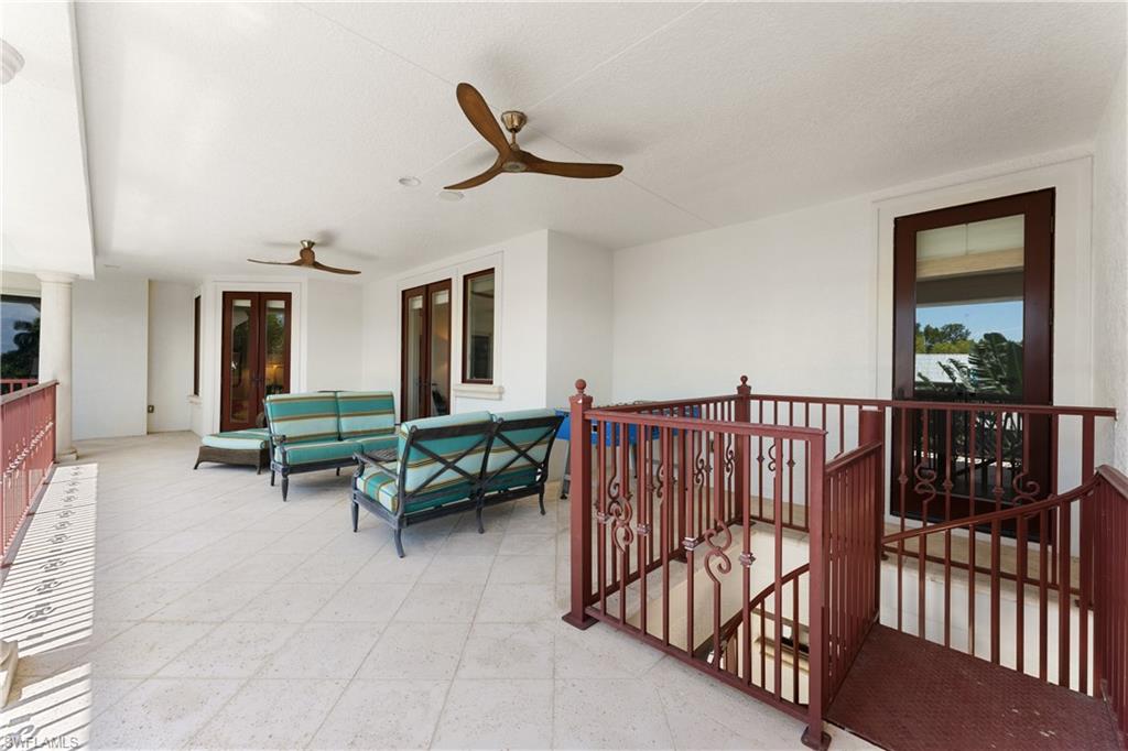 590 17th Avenue South Naples, FL 34102 - Photo 34 of 50 a living room with furniture and a window