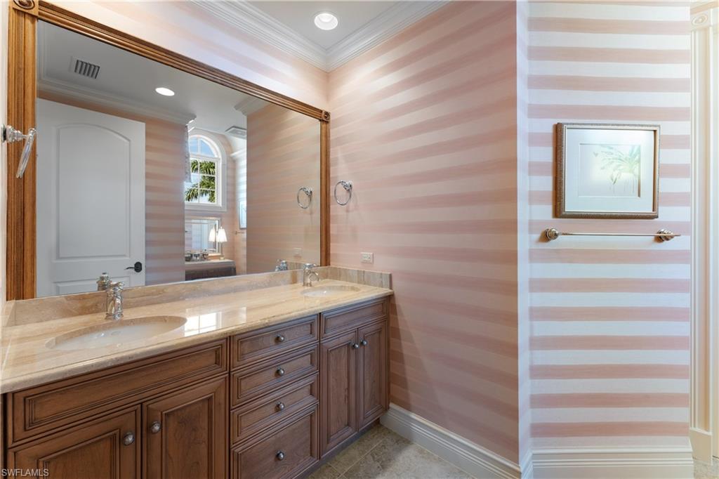 590 17th Avenue South Naples, FL 34102 - Photo 37 of 50 a bathroom with a granite countertop sink and a mirror