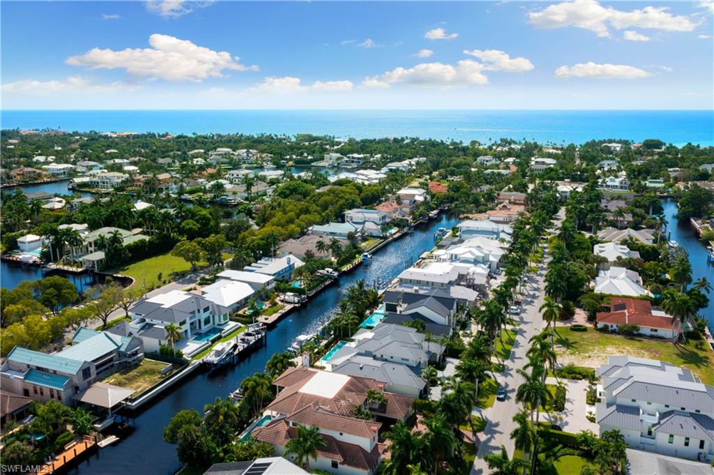 590 17th Avenue South Naples, FL 34102 - Photo 4 of 50 an aerial view of residential houses with outdoor space