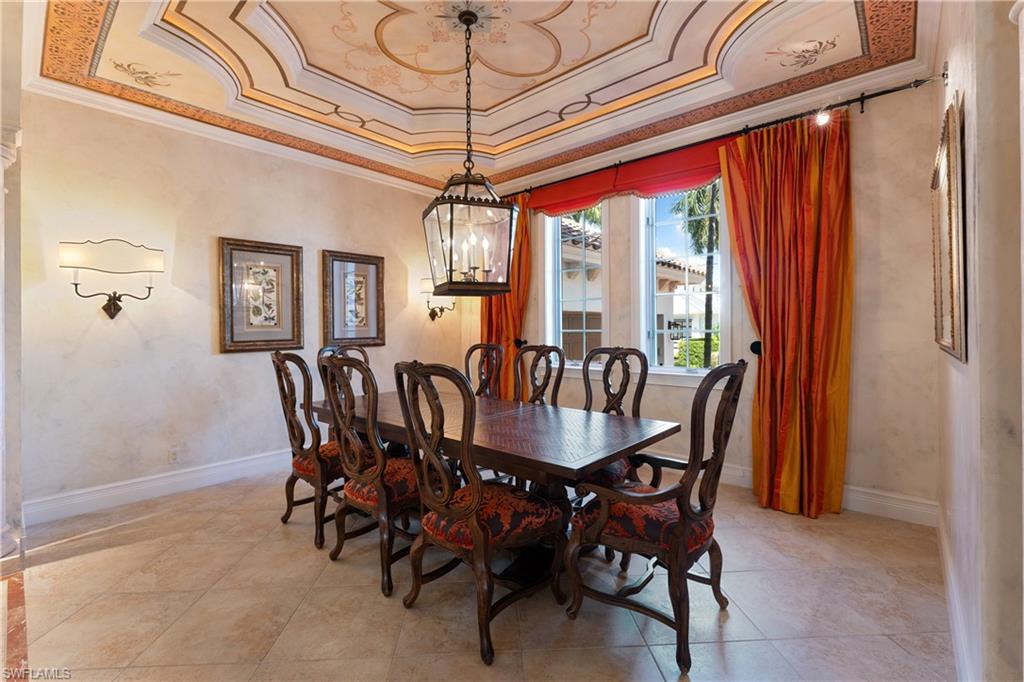 590 17th Avenue South Naples, FL 34102 - Photo 5 of 50 a view of a dining room with furniture window and wooden floor