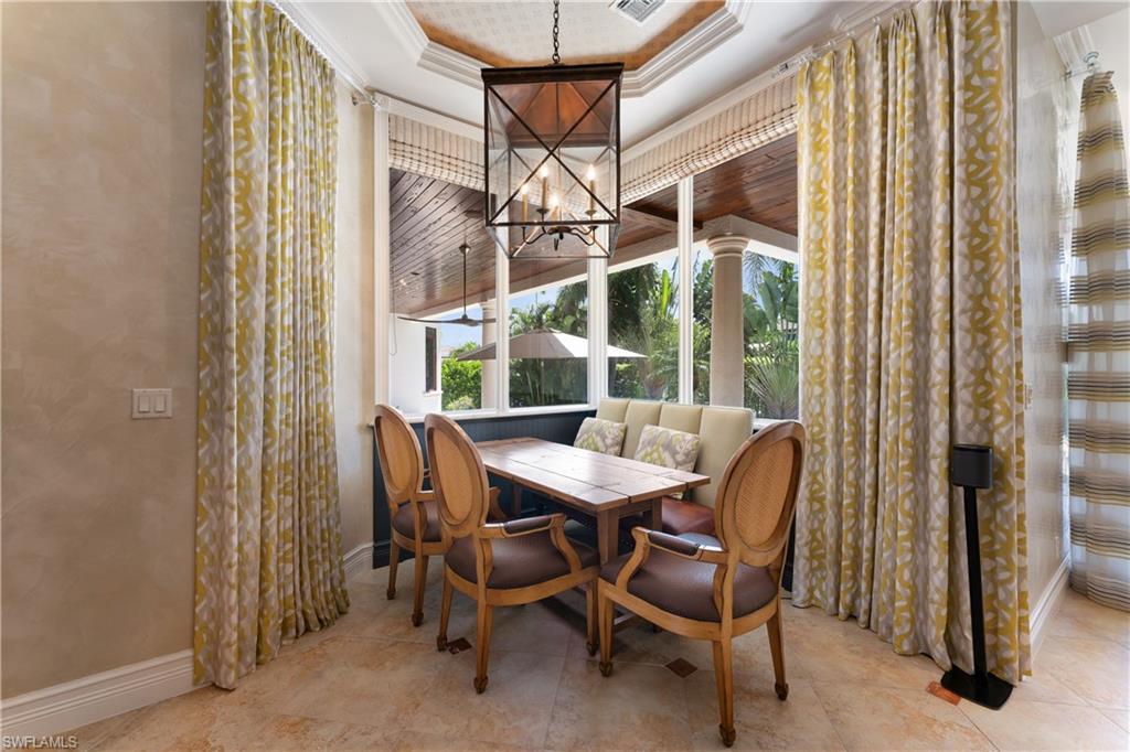 590 17th Avenue South Naples, FL 34102 - Photo 9 of 50 a view of a dining room with furniture and window