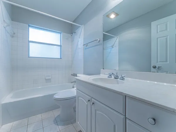 a bathroom with a sink a toilet and a bathtub