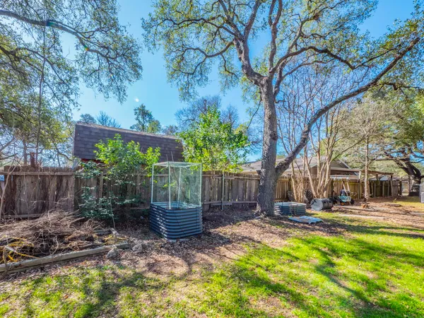 a view of a backyard with tree s