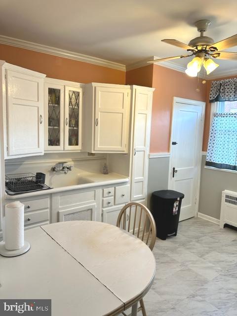 7124 Forrest Avenue Philadelphia, PA 19138 - Photo 25 of 51 a kitchen with a table chairs sink and cabinets