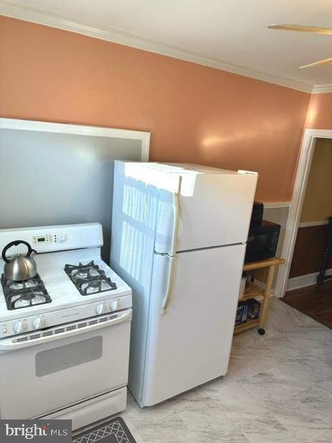 7124 Forrest Avenue Philadelphia, PA 19138 - Photo 26 of 51 a kitchen with a stove and a refrigerator