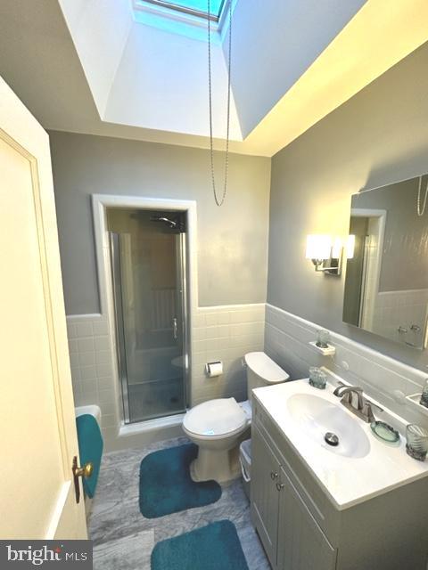 7124 Forrest Avenue Philadelphia, PA 19138 - Photo 44 of 51 a bathroom with a sink a toilet a mirror and shower