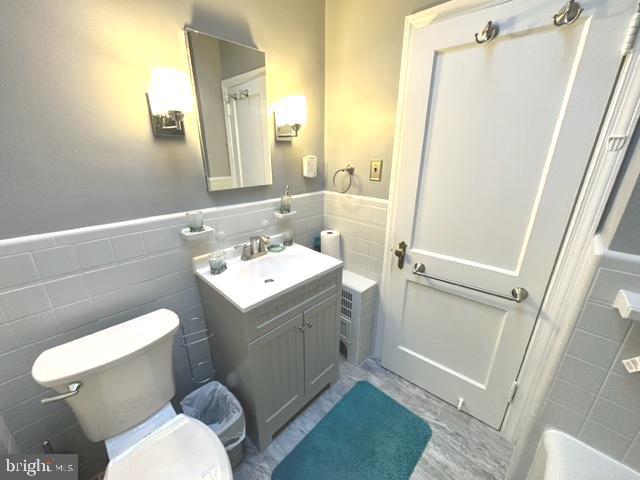 7124 Forrest Avenue Philadelphia, PA 19138 - Photo 45 of 51 a white toilet sitting next to a bathroom sink