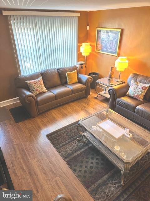 7124 Forrest Avenue Philadelphia, PA 19138 - Photo 10 of 51 a living room with furniture and a large window